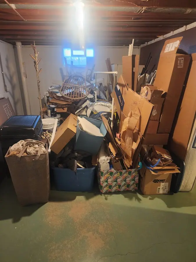 Roll-off dumpster container at job site for 2 Yard Dumpster Rental in Melbourne Beach