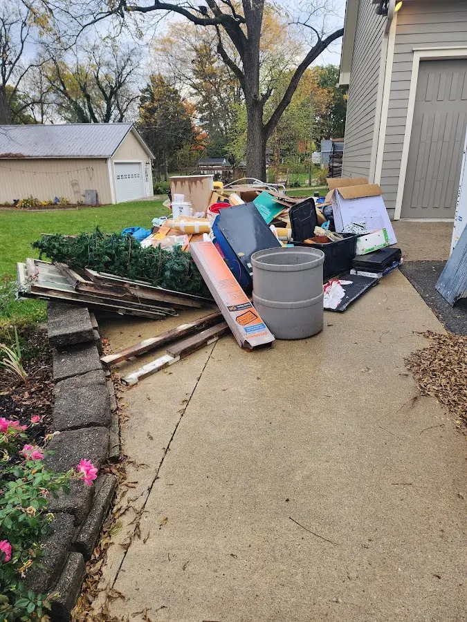 Dumpster being loaded with debris for 3 Yard Dumpster Rental in Melbourne Beach
